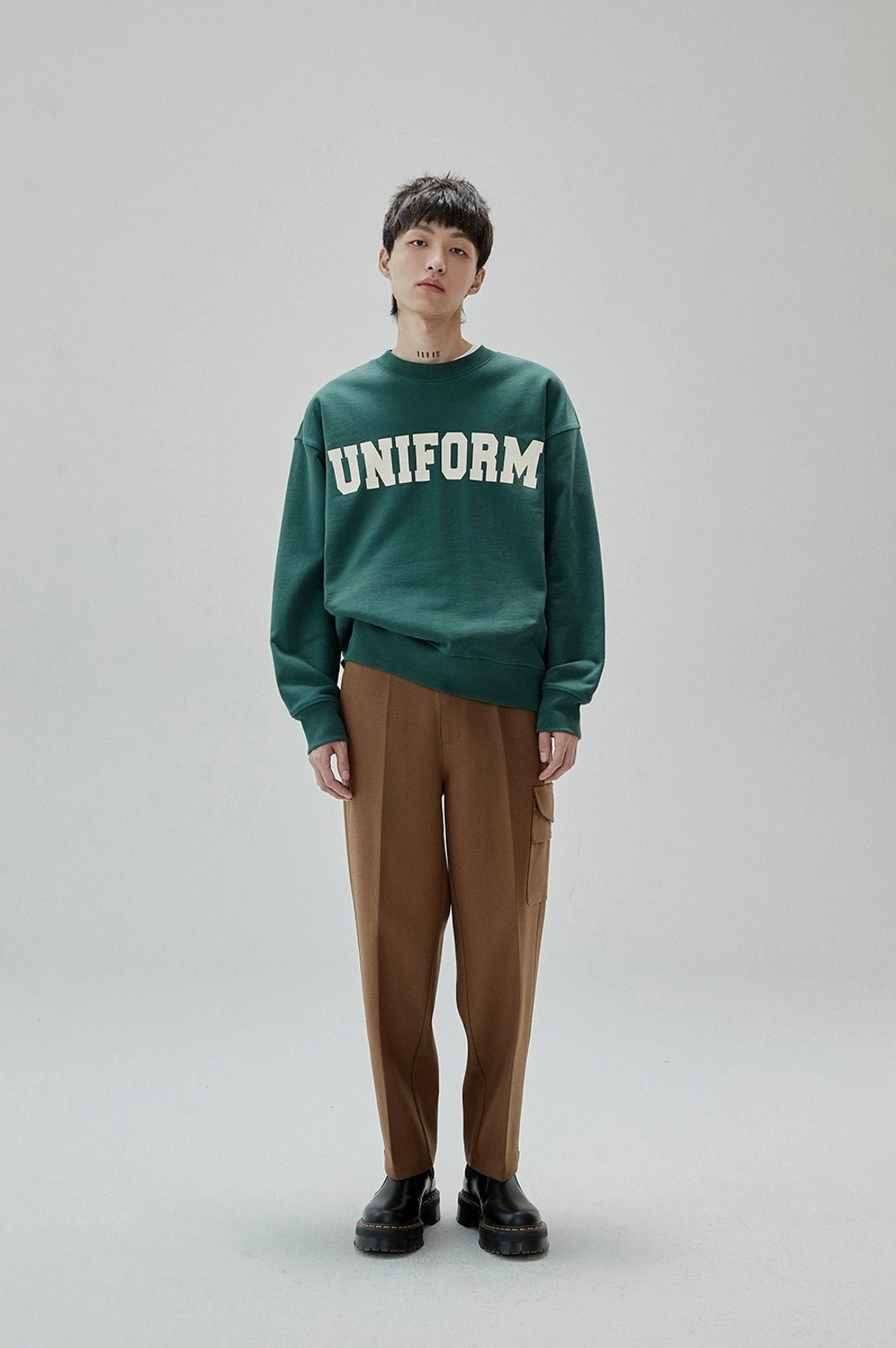 Bold collegiate lettering crewneck sweatshirt with a clean vintage streetwear aesthetic