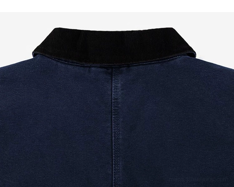 Bold two-tone work jacket with practical utility styling, oversized pockets, and a modern cropped streetwear cut