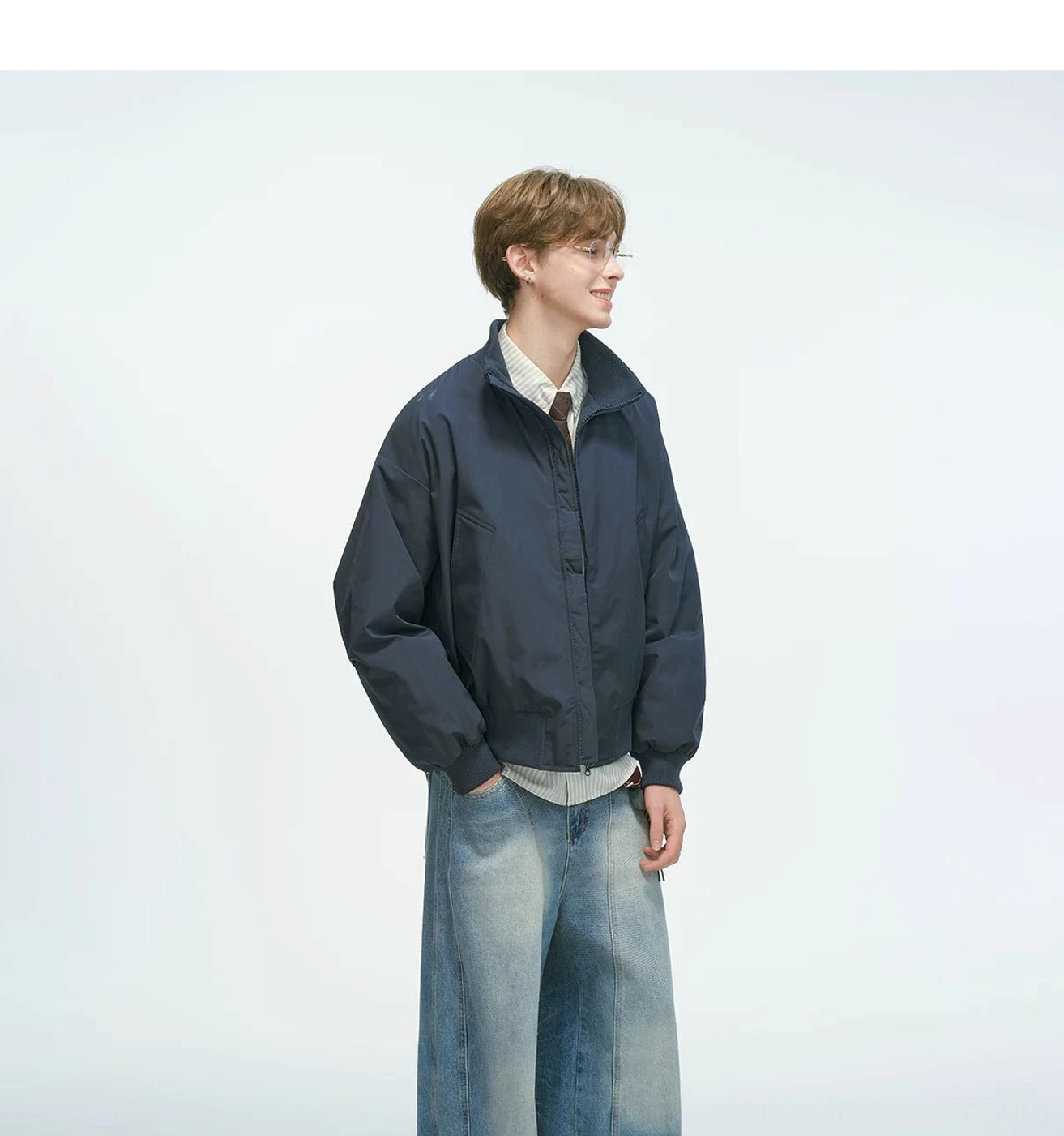 Relaxed fit bomber jacket showing overall silhouette with drop shoulders and slightly cropped length sitting at hip, streetwear layering piece