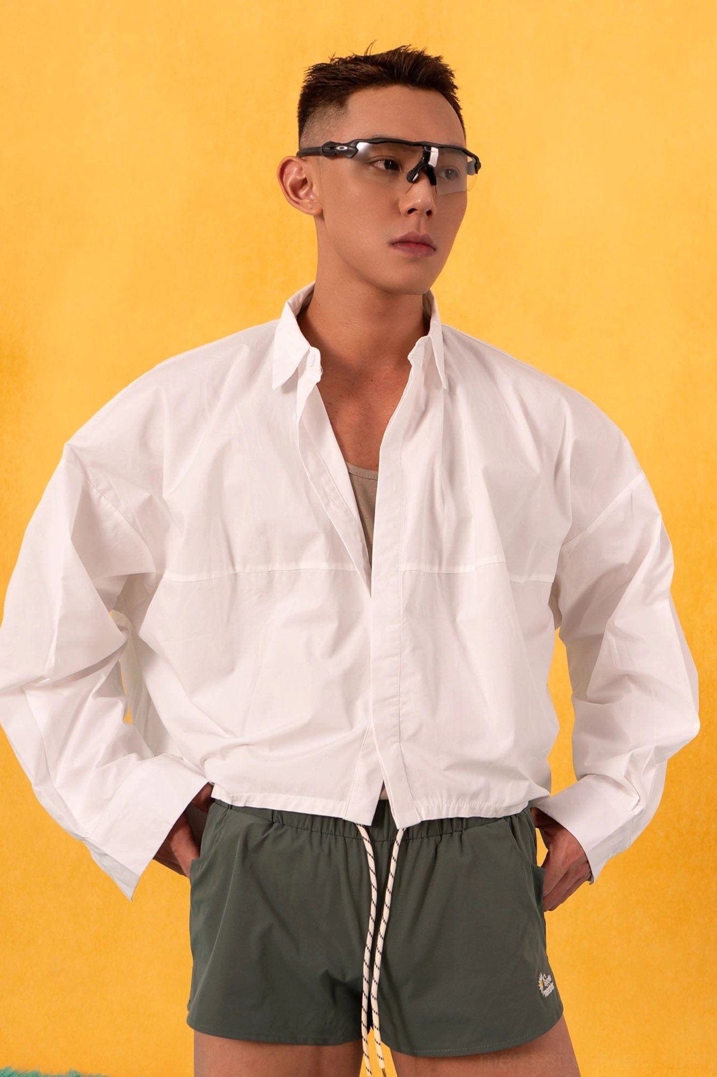 Boxy oversized poplin shirt detail view highlighting the crisp cotton texture, button front, and relaxed streetwear cut