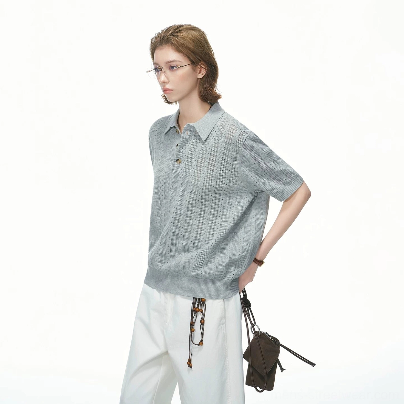 Breathable short-sleeve pointelle polo shirt with relaxed drape for casual summer layering and wide-leg trousers