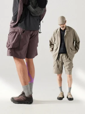 Men's breathable cargo shorts shown in front and side views with a relaxed loose fit, large utility pockets, and contemporary outdoor streetwear styling
