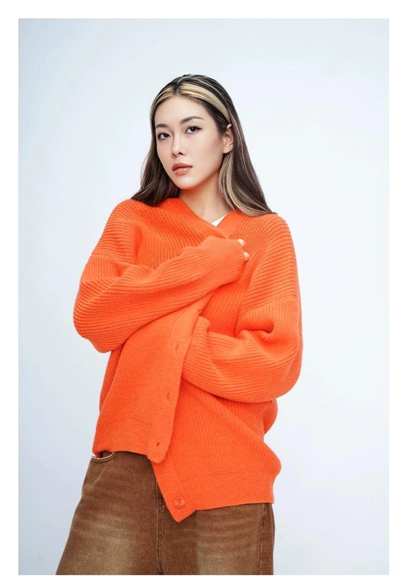 Bright orange oversized fuzzy knit cardigan with relaxed fit, long sleeves, V-neck button front, and Korean streetwear styling
