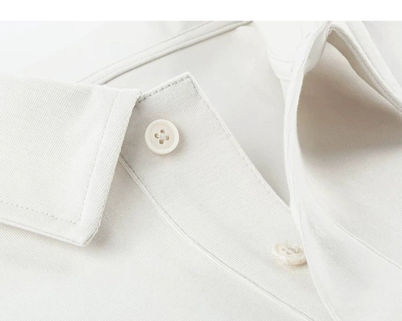 Detailed view of bright white pocket polo shirt collar, resin buttons, front placket, and precise Korean streetwear stitching