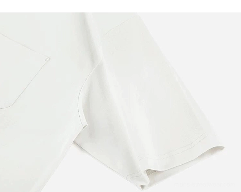 Close up of bright white technical polo sleeve and left chest patch pocket with straight hem and smooth fabric texture