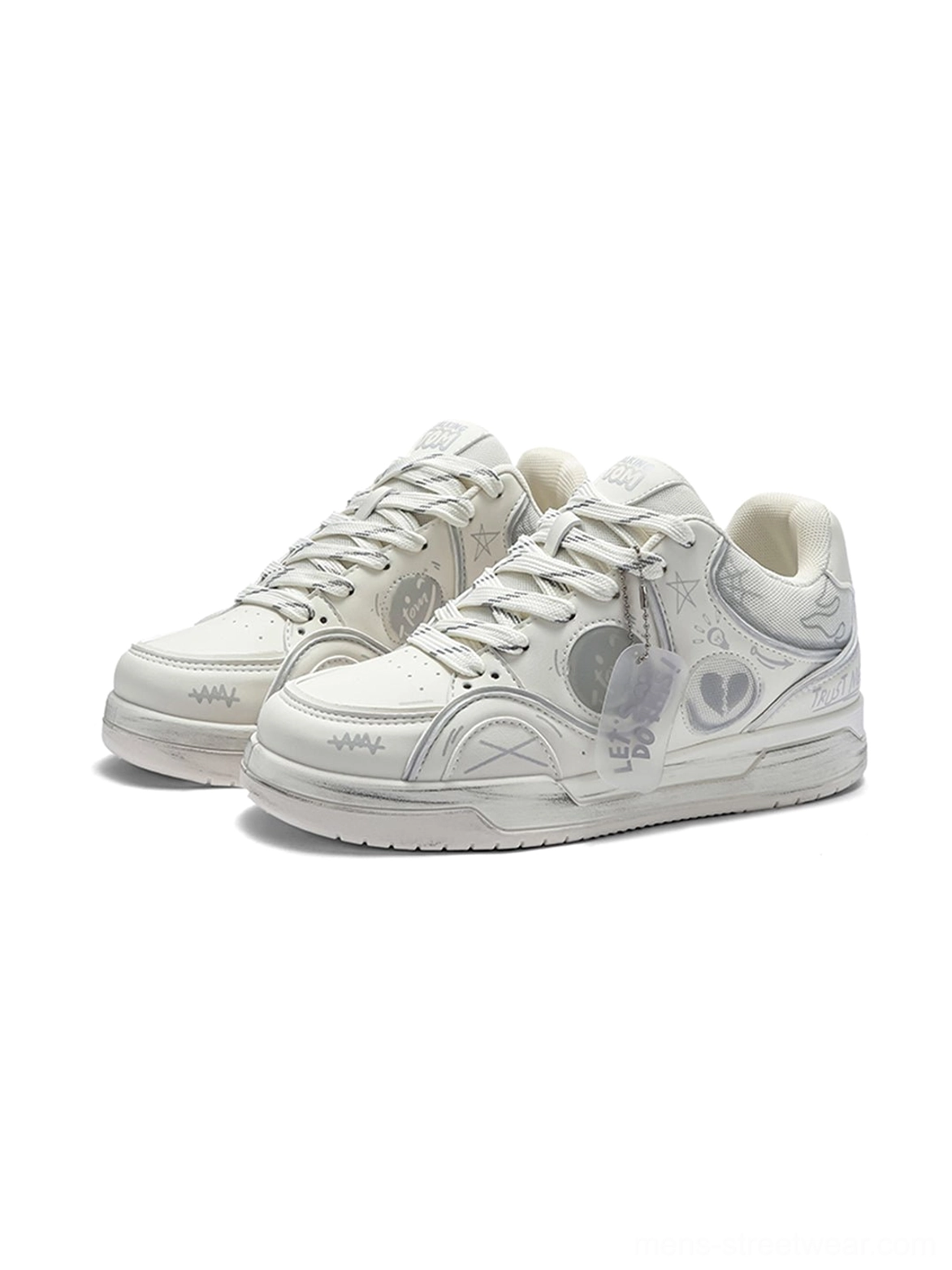 All-white minimalist broken-heart graffiti low-top sneakers with subtle artwork and thick white rubber sole