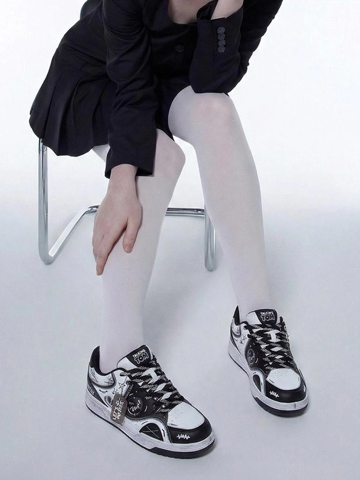 Fashion low-top sneakers with colorful heart graffiti, layered contrast panels, and skate-inspired streetwear design