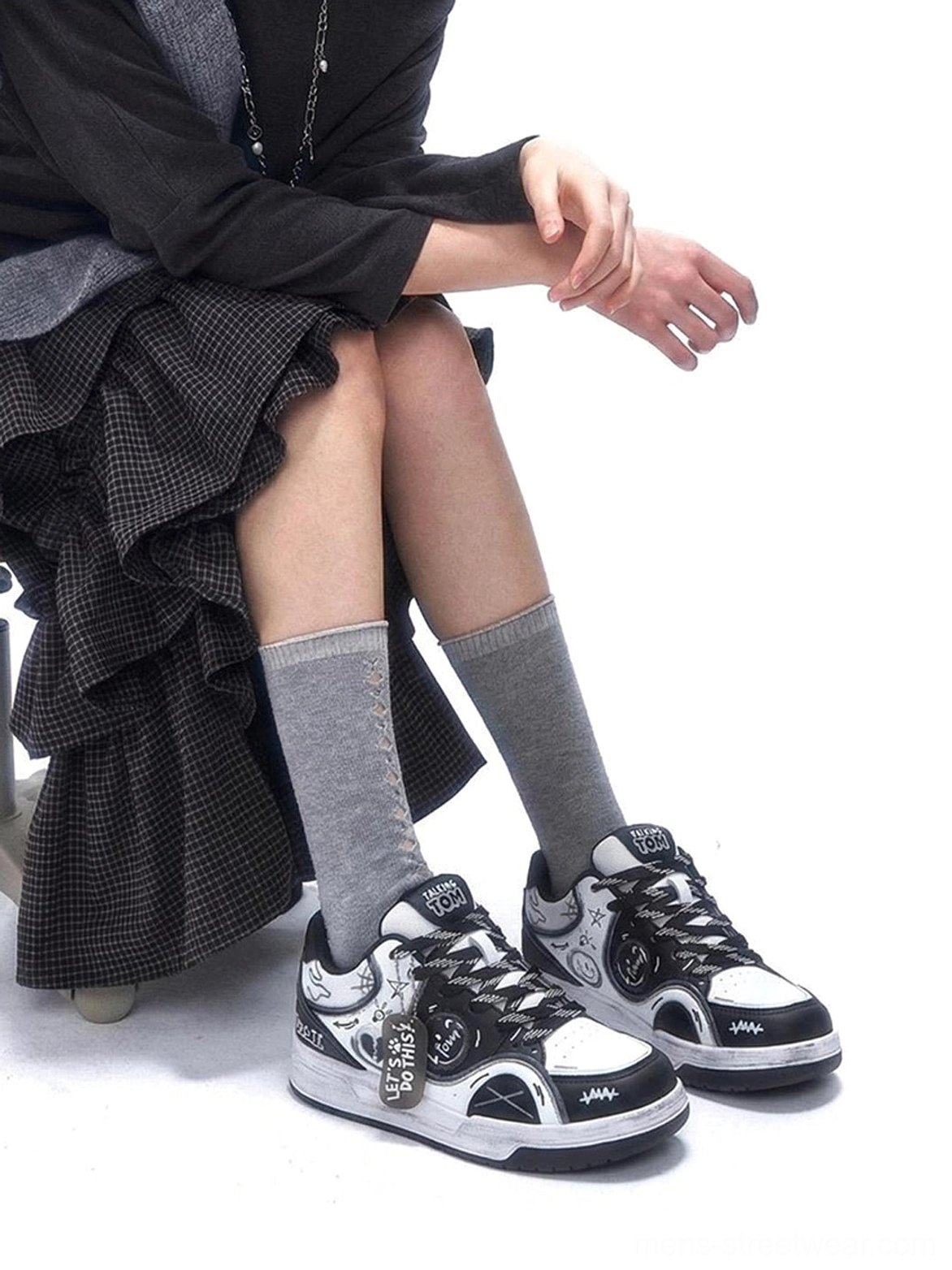 Casual graffiti sneakers with broken-heart motifs, synthetic leather upper, and thick low-top sole