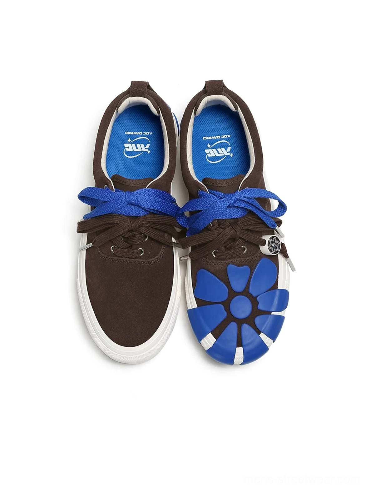 Top-down view of brown and blue daisy-detail suede platform sneakers with asymmetrical floral toe decoration and blue mesh insoles