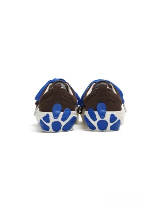Rear view of brown suede streetwear platform sneakers showing blue laces, padded heel counters, and blue paw-shaped outsole graphics