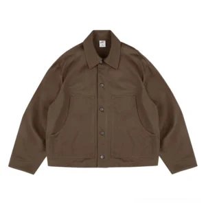 Brown boxy cotton work jacket front flat lay with snap button closure and oversized patch pockets