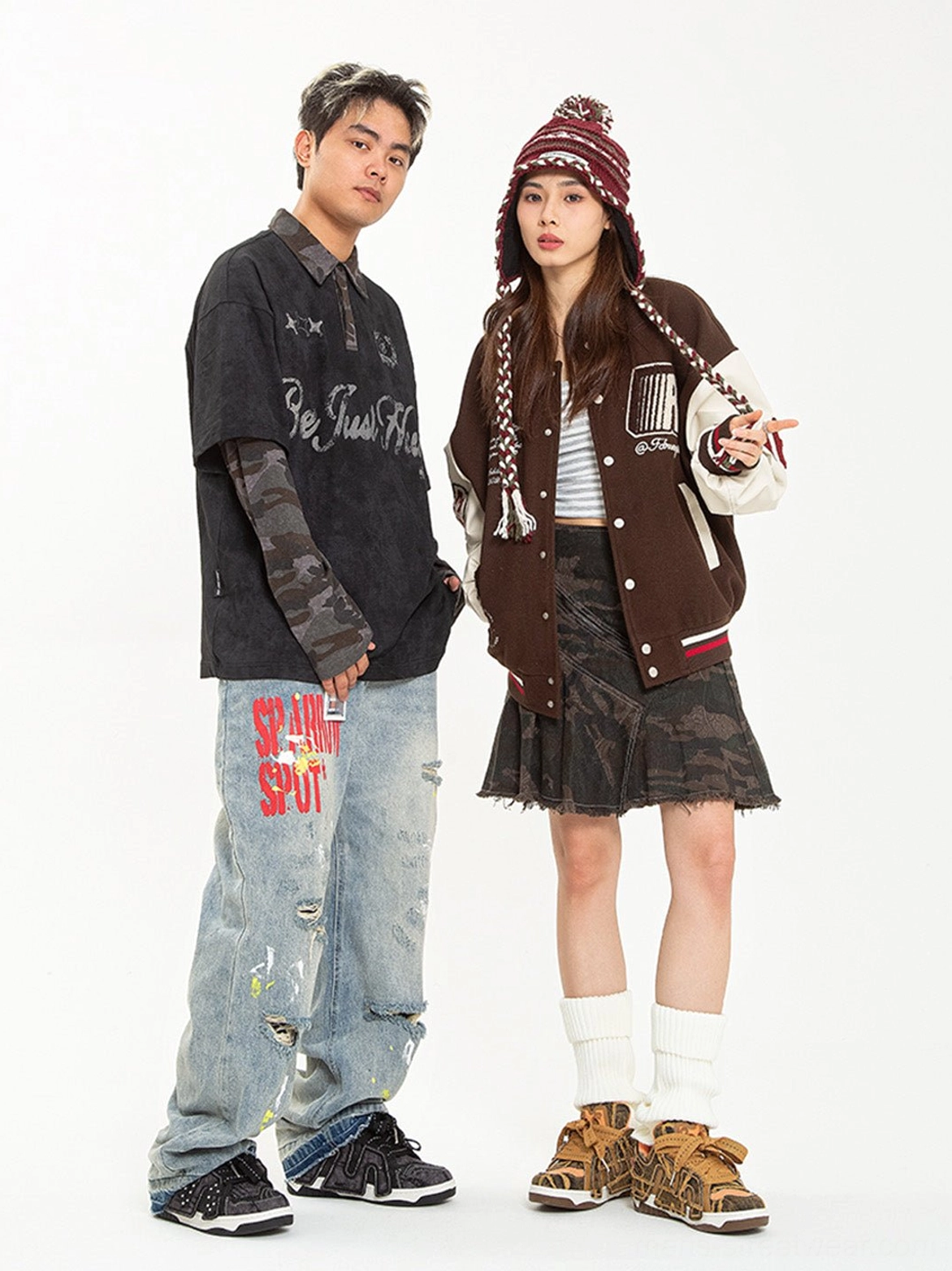 Side view of a streetwear couple with brown camouflage rivet platform skate sneakers and casual urban outfits