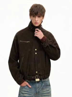 Brown corduroy utility bomber jacket with stand collar chest zip pockets and gold hardware three-quarter front view