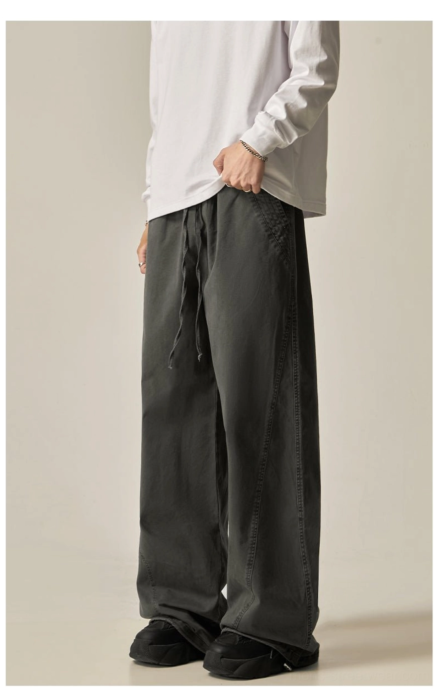 Brown drawstring wide-leg pants back view relaxed proportions side seam detail washed brown tone oversized contemporary