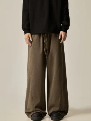Brown drawstring wide-leg pants front full length view structured side seams floor-length silhouette oversized streetwear