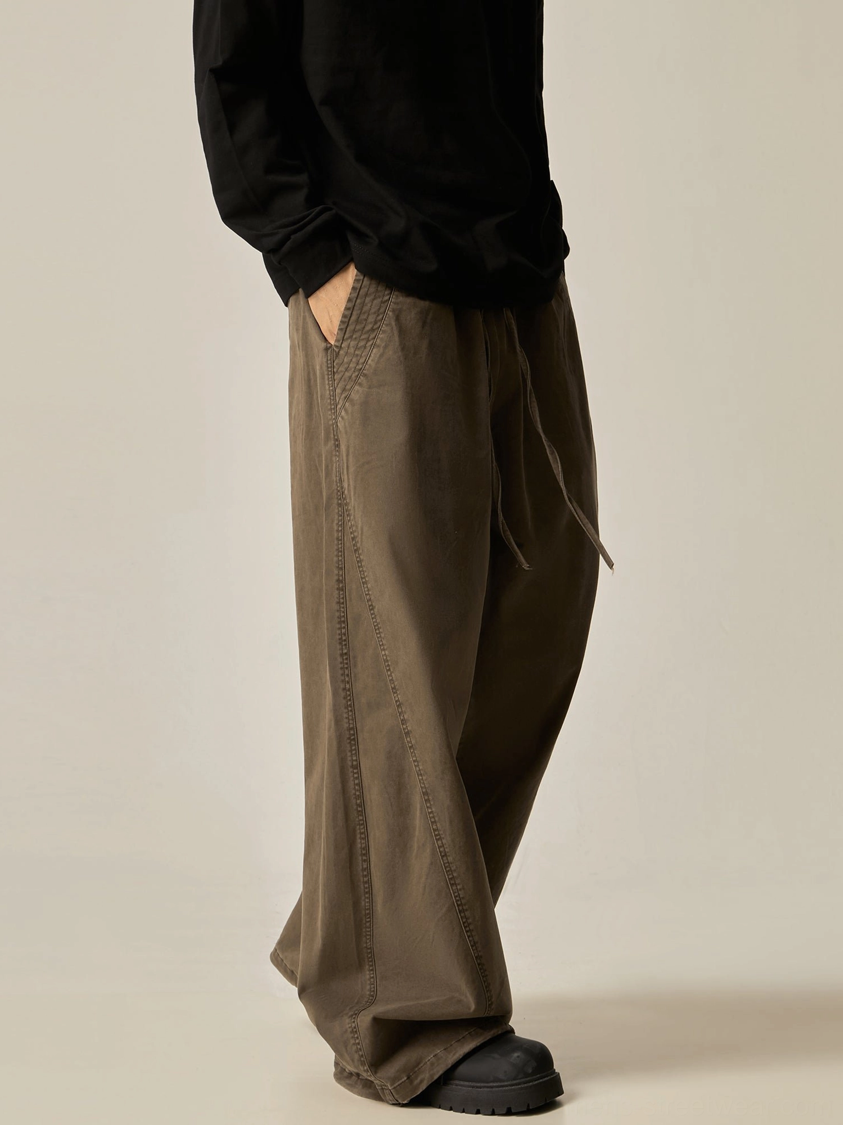 Brown wide-leg drawstring pants right profile view vintage washed tone side slip pocket drapey relaxed proportions