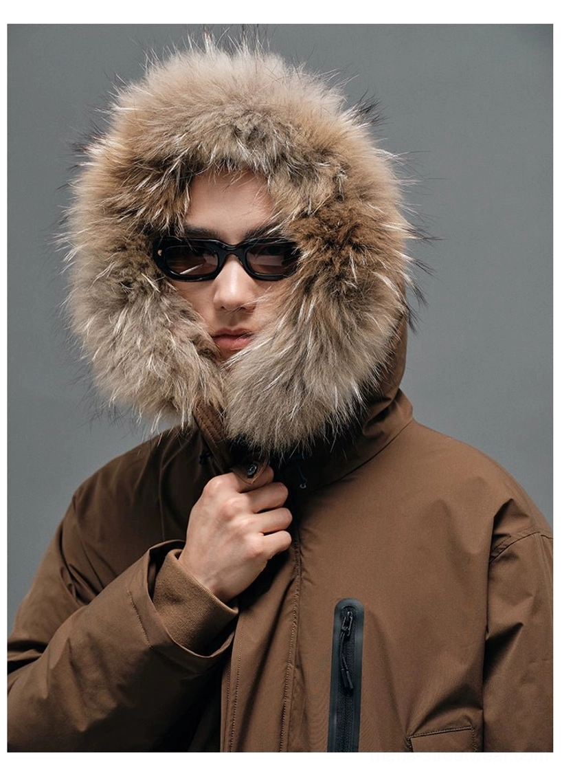 Brown fur-collar hooded down coat worn with the hood up showing the full plush trim and functional front zipper pocket