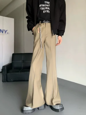 Brown high-waisted flare trousers with pressed front crease and wide leg opening styled in a modern Seoul streetwear outfit