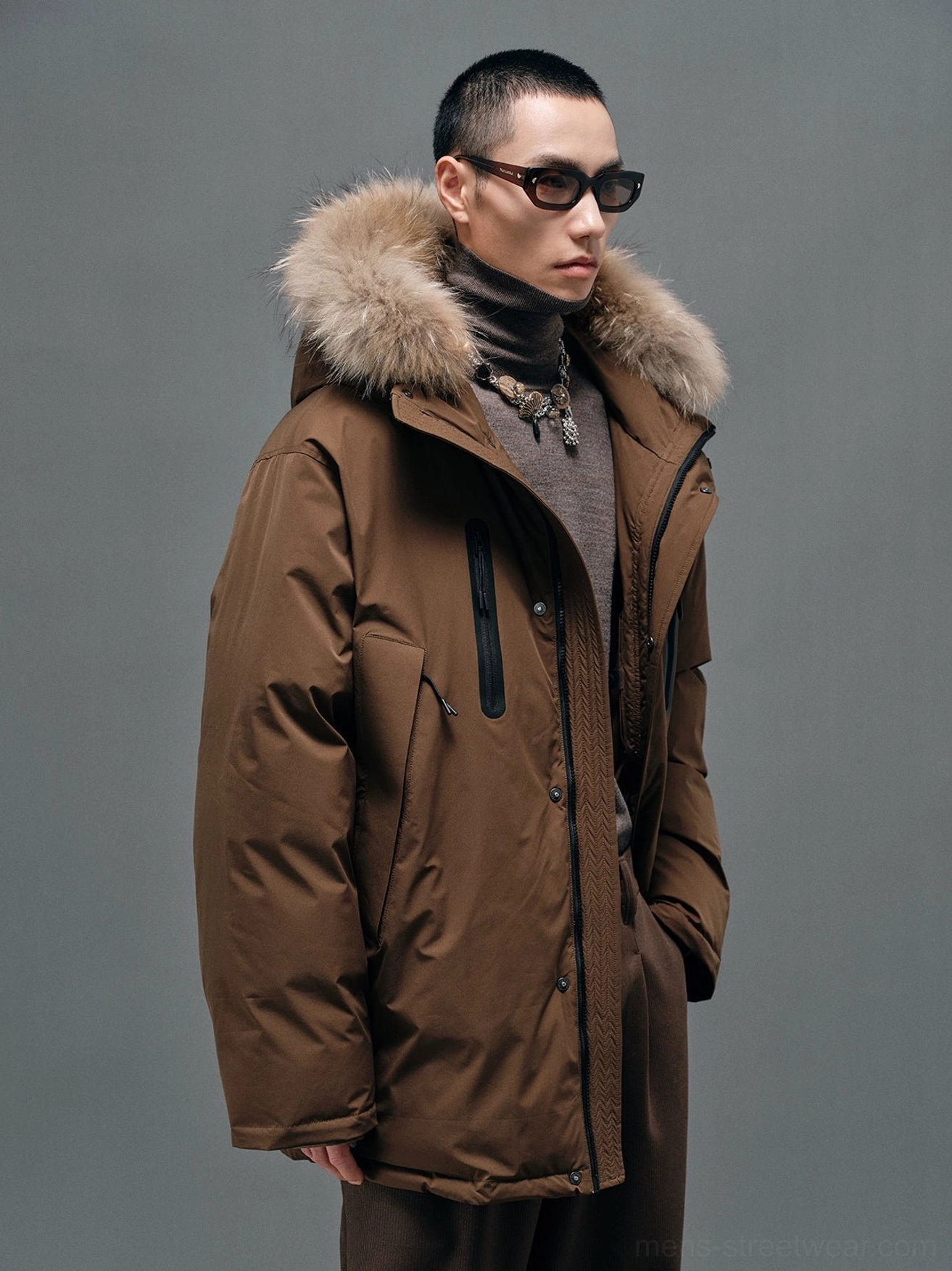 Brown hooded white duck down coat shown from a side three-quarter angle with relaxed A-line streetwear proportions