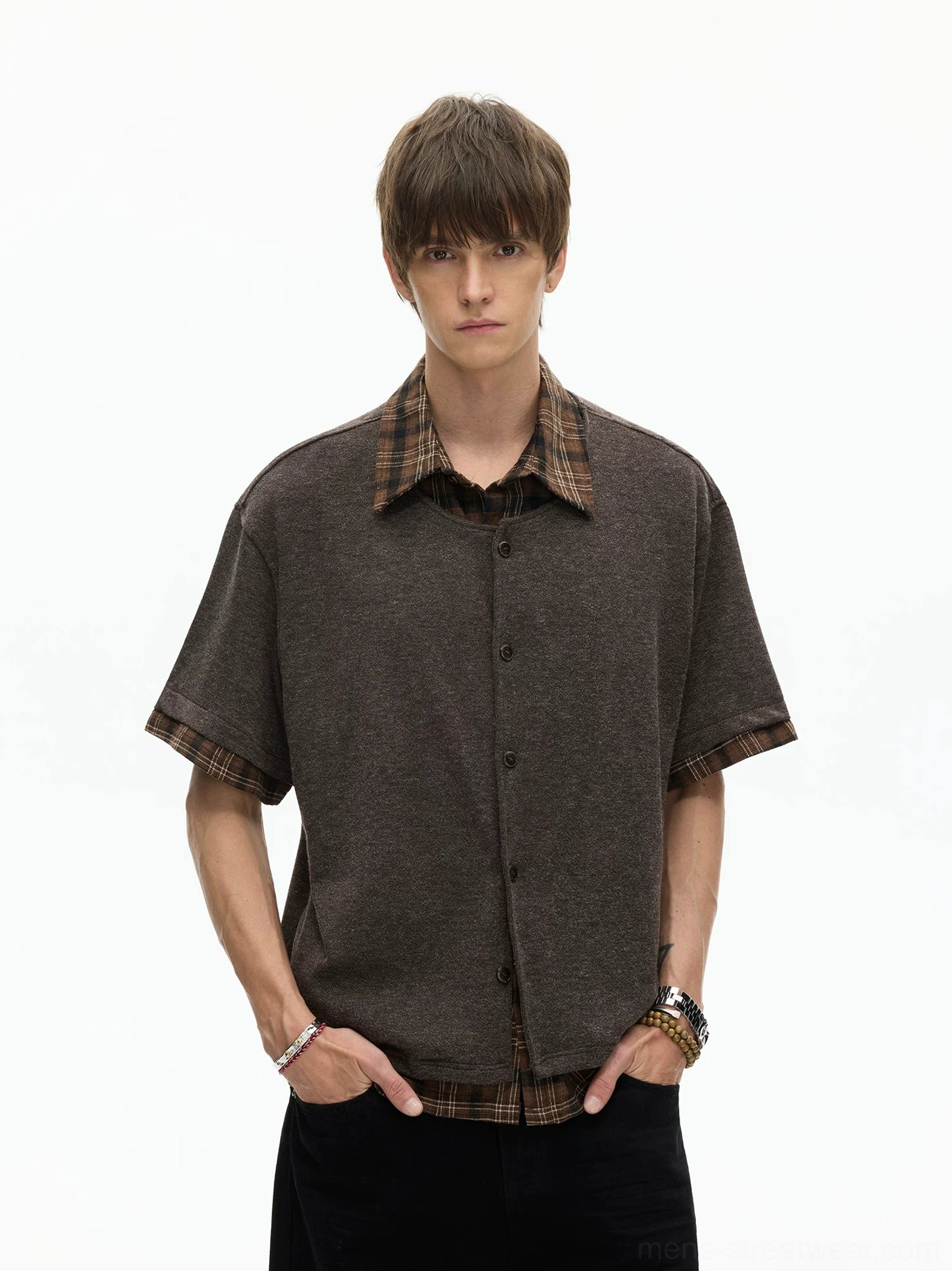 Brown layered plaid hem knit shirt with exposed checked collar and hem styled with black wide-leg pants