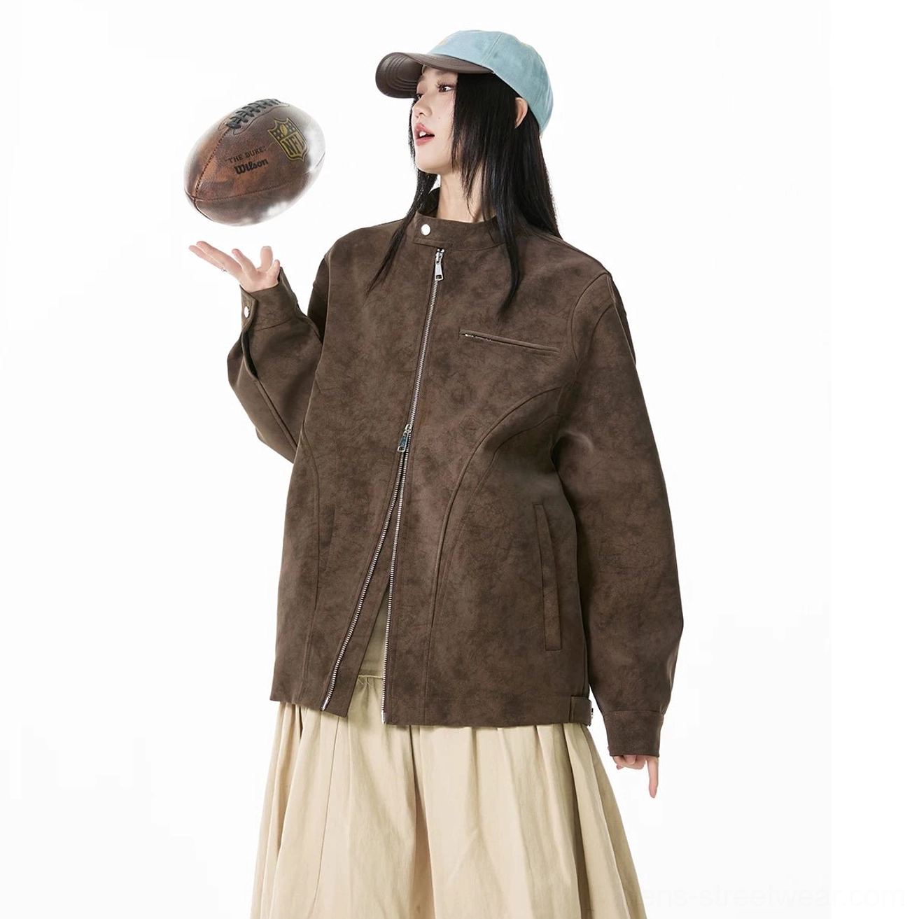 Brown mottled faux suede moto zip jacket with stand collar styled with beige midi skirt and baseball cap