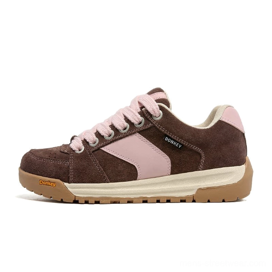 Brown and pink suede court sneakers with contrast color-block upper, matching pink laces, and vintage gum outsole