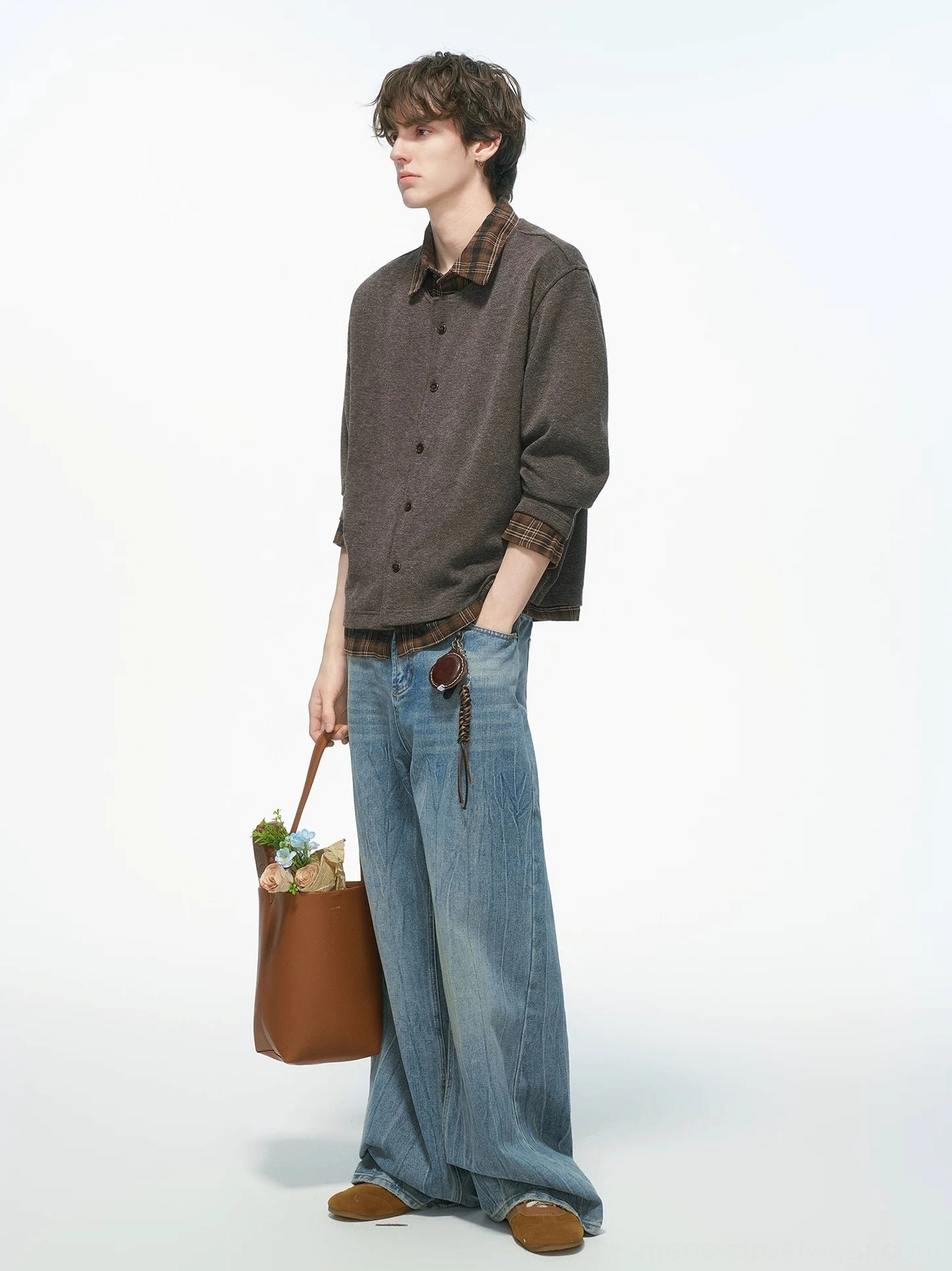 Heather brown plaid collar knit shirt jacket shown from the side with a leather tote bag and vintage streetwear styling