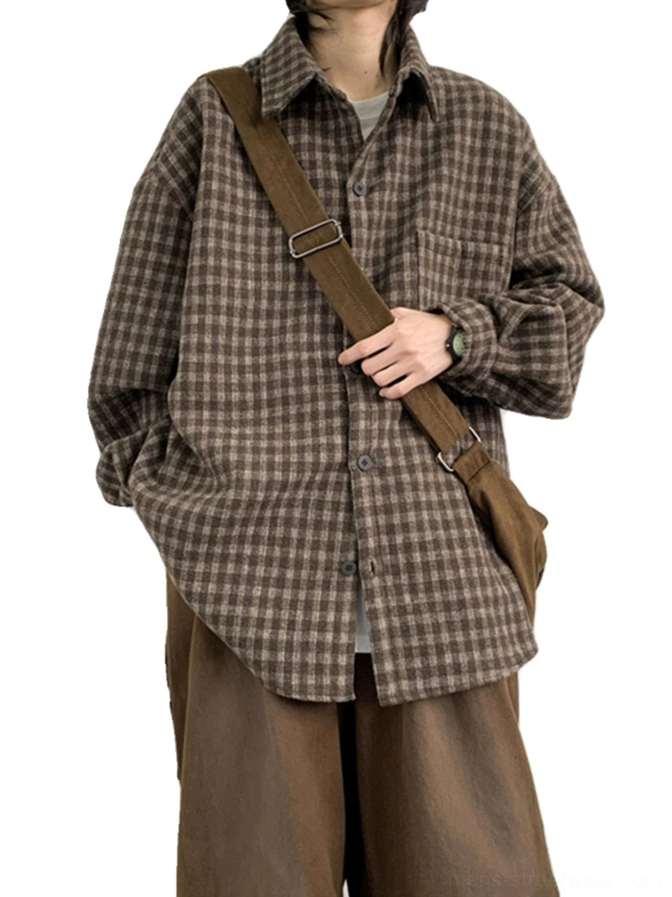 Close-up of brown plaid flannel shirt showing pointed collar button-front closure brushed texture and chest pocket