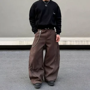 Coffee brown shadow rivet ultra wide-leg denim jeans front view with curved panel seams and relaxed Korean streetwear fit