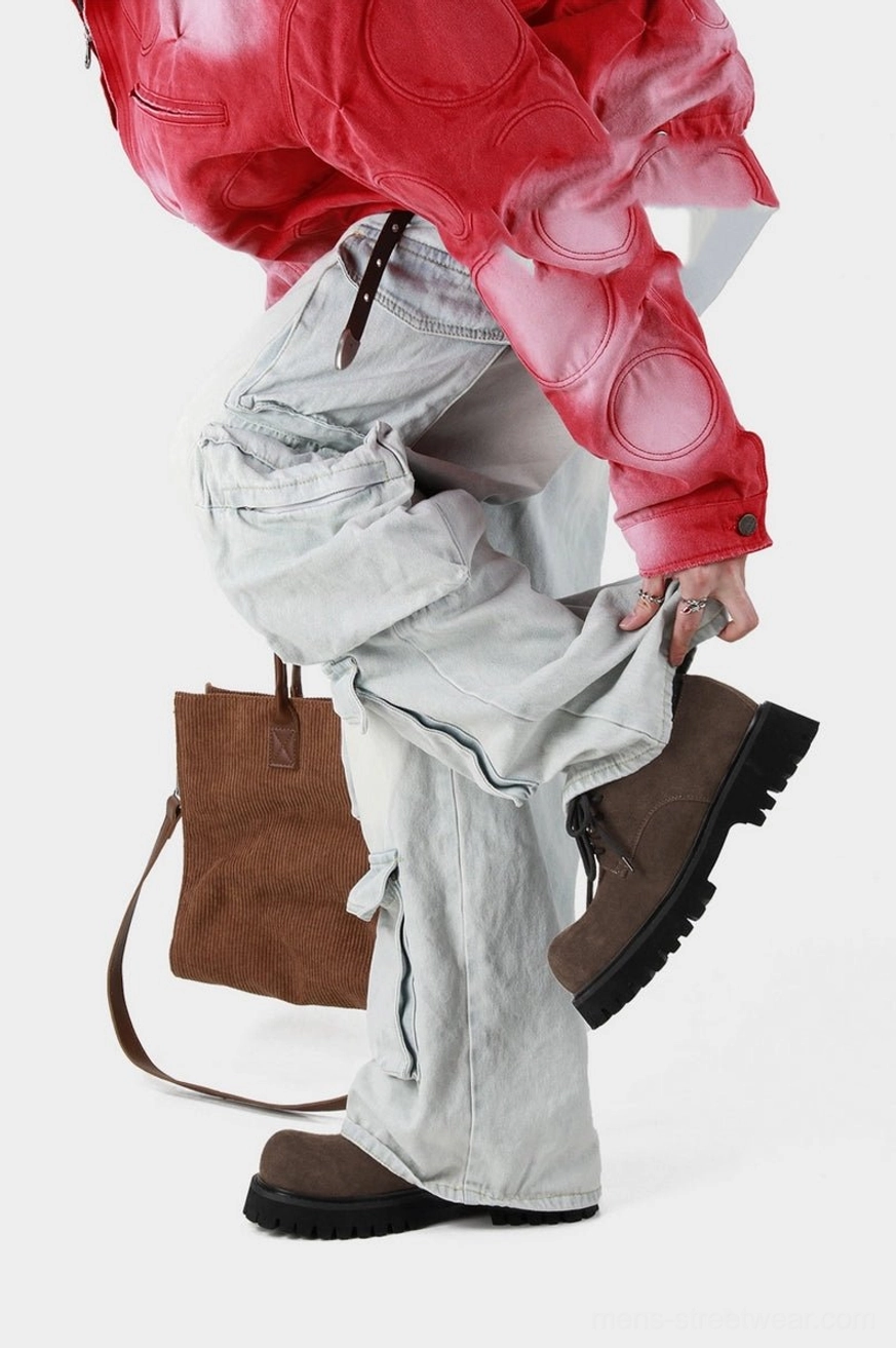 Brown suede lug-sole derby shoes styled with a red cropped jacket, light gray cargo pants, and a brown leather tote bag