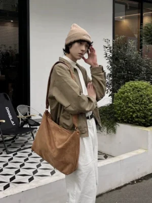 Brown suede-feel drape hobo tote worn crossbody with Korean casual streetwear outfit
