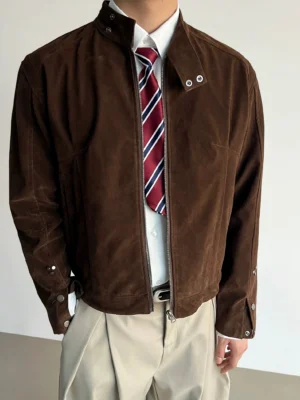 Brown suede-look stand collar zip jacket close-up with snap collar buttons and matte Korean streetwear texture