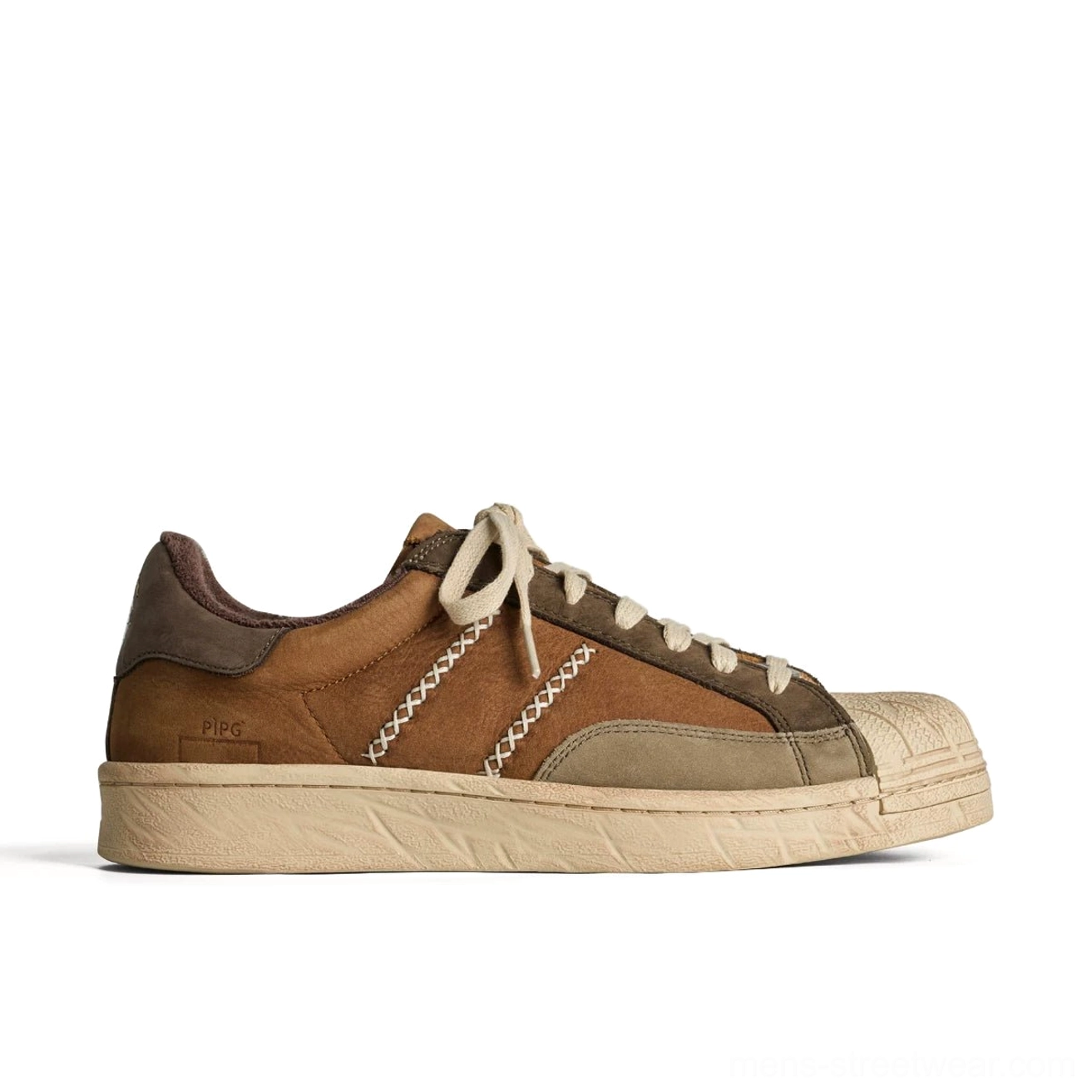 Side profile of brown and tan leather casual sneaker with cream decorative stitching and aged-look rubber outsole