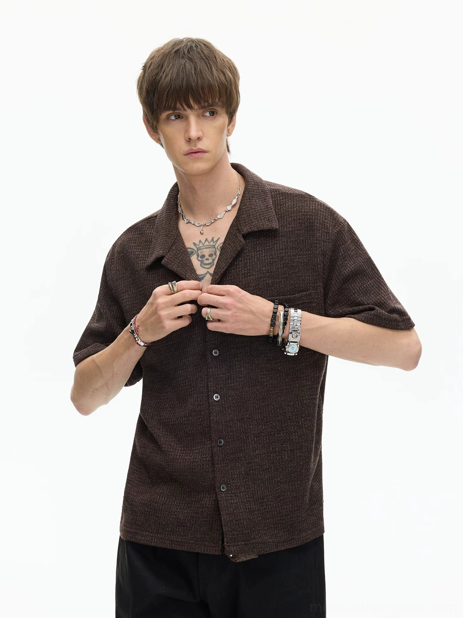 Brown woven textured camp collar shirt close-up showing front button placket and relaxed Korean streetwear styling with layered jewelry