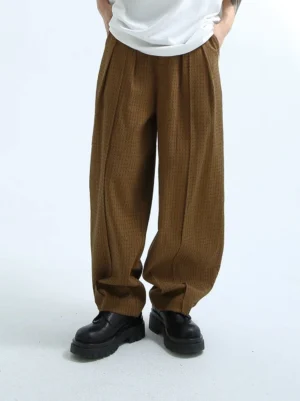Brown textured corduroy wide-leg pleated streetwear pants front full-body view with oversized white T-shirt and black platform loafers