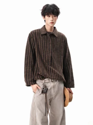Brown textured vertical stripe Henley shirt with loose oversized fit styled with light gray wide-leg pants