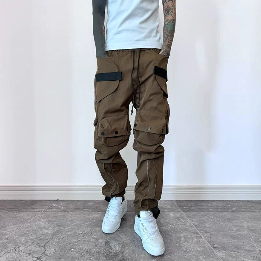 Brown thick style techwear cargo joggers with utility pockets, webbing accents and adjustable tapered cuffs