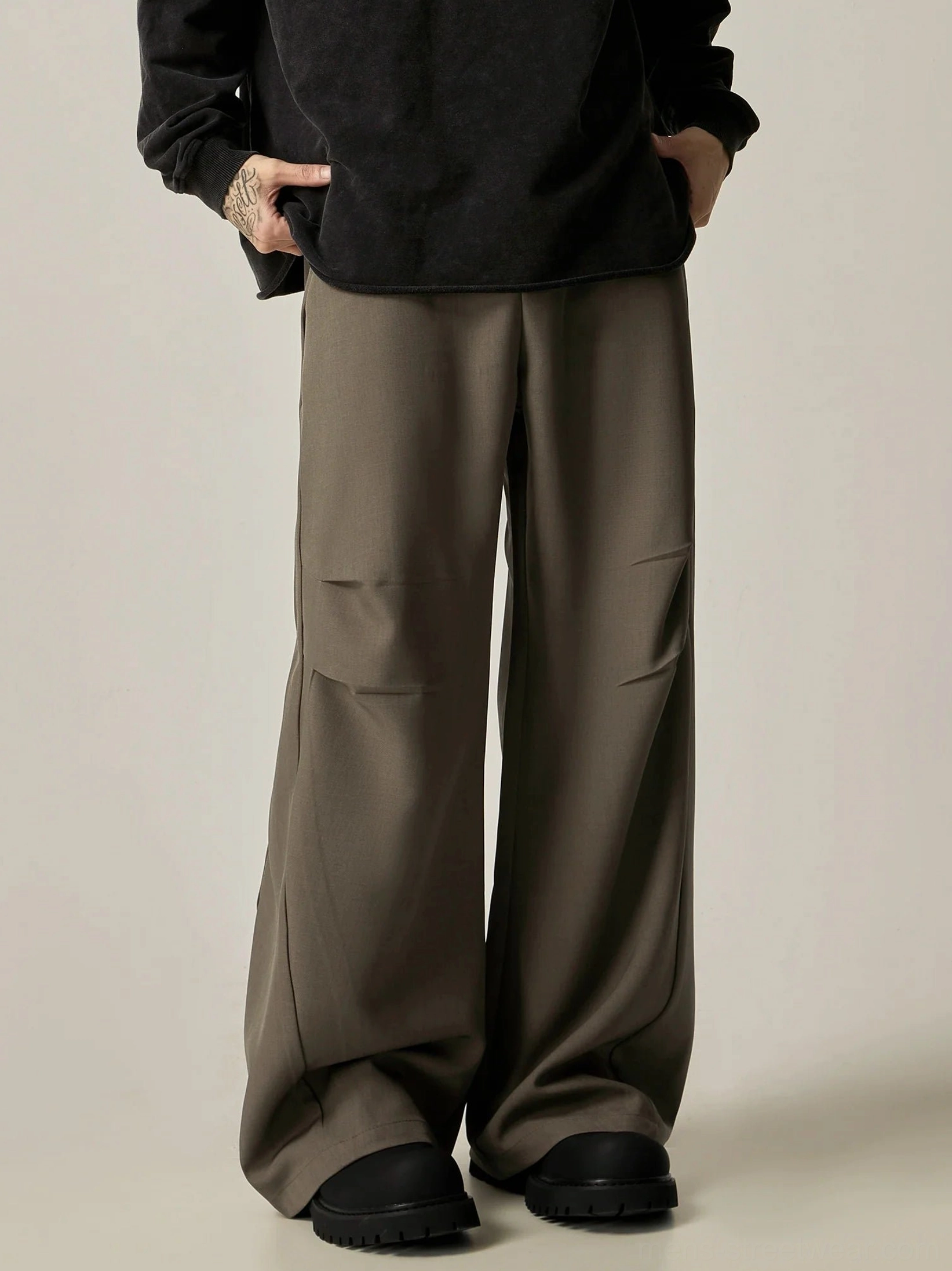Brown ultra-wide leg dress trousers front view styled with black long sleeve top in minimalist Korean streetwear outfit