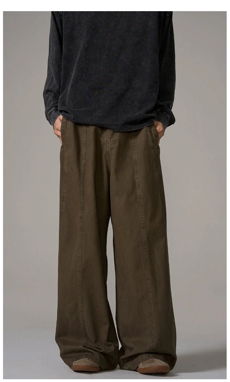 Front full-body model wearing classic brown wide-leg streetwear trousers with central seam and relaxed Seoul fashion fit