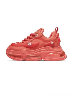 Bubble Max chunky sneakers in bright red with transparent air-cushion sole, lace-up streetwear design, and side logo detail shown in left profile