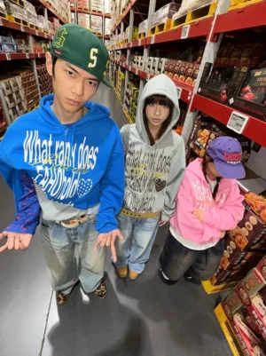 Bubblegum Manifesto graphic zip hoodie streetwear group look in blue pink and flower gray inside supermarket aisle