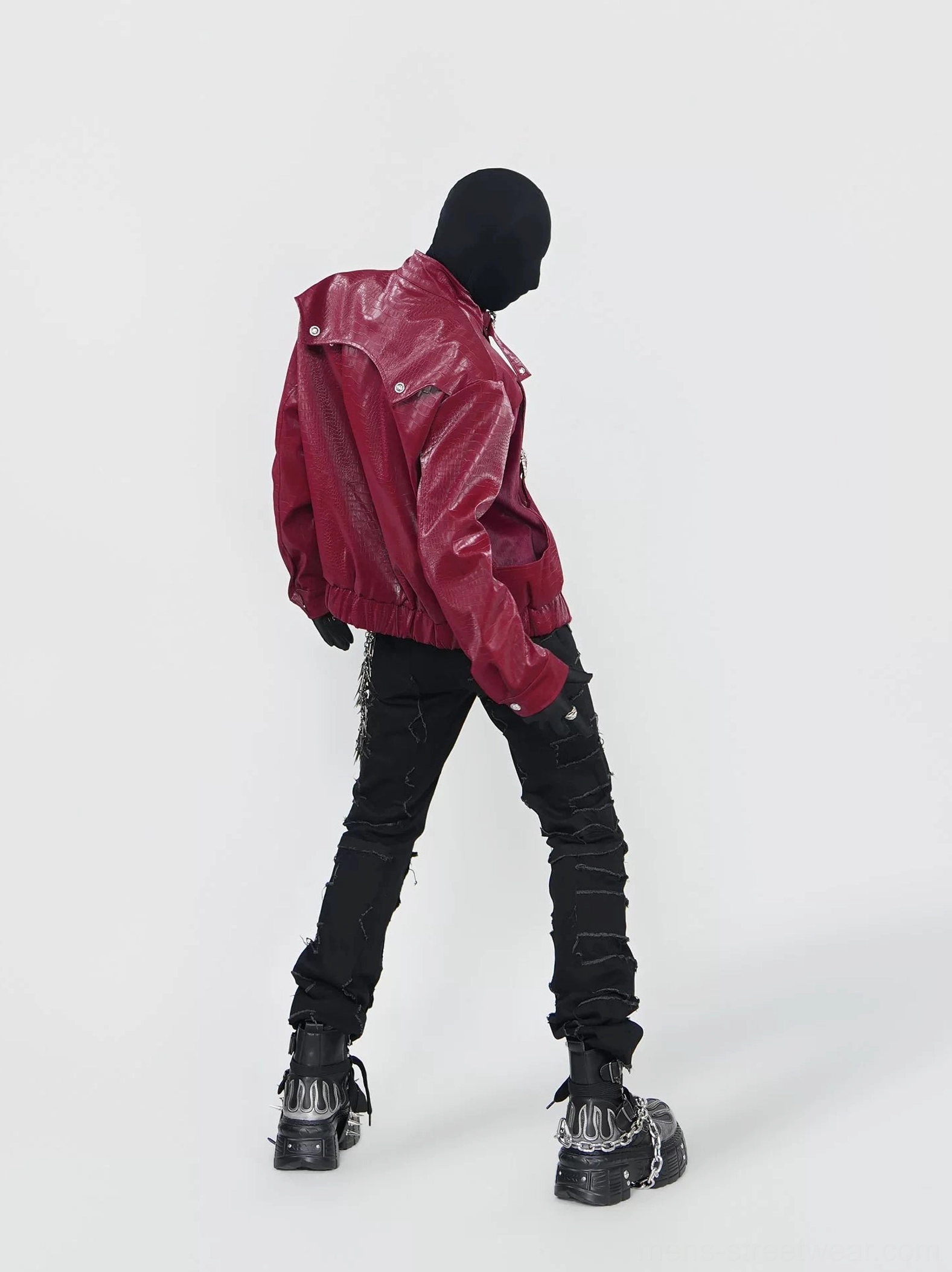 Rear view of burgundy crocodile embossed faux leather jacket with cropped hem, relaxed fit and alternative punk streetwear styling