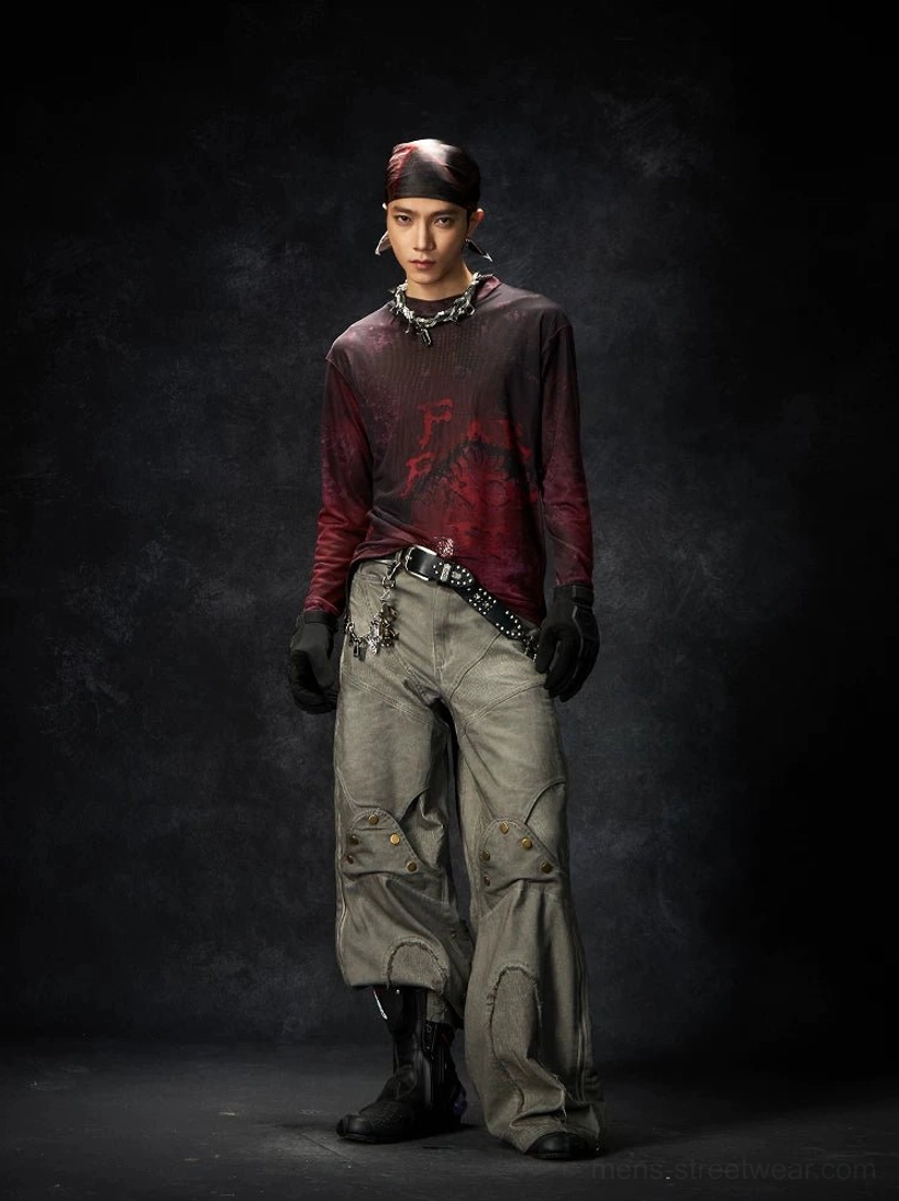 Burgundy faded graphic long sleeve streetwear tee styled with wide leg cargo pants and a chain belt