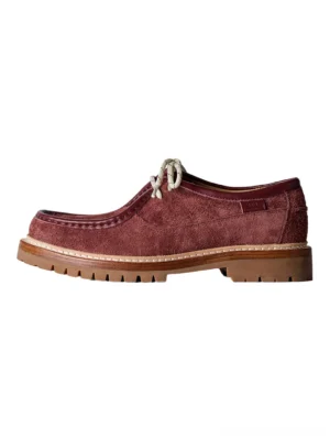 Burgundy suede moc-toe lace-up work loafers in a side profile with rugged lug sole and contrast stitching