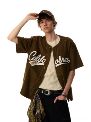 Brown California script corduroy baseball shirt in a relaxed streetwear fit shown from a three-quarter front view