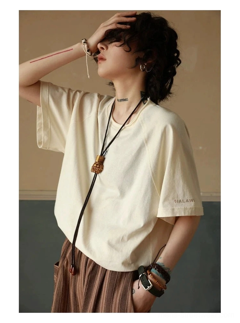 Casual cotton raglan T-shirt featuring layered neckline details and an easy oversized streetwear silhouette