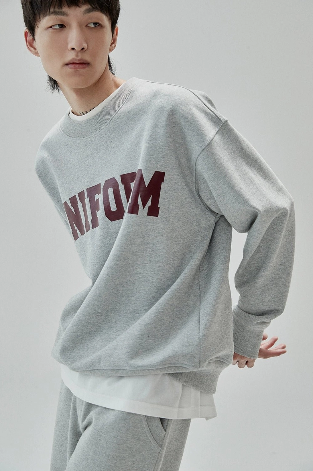Casual cotton UNIFORM sweatshirt designed for layered Seoul-inspired streetwear styling