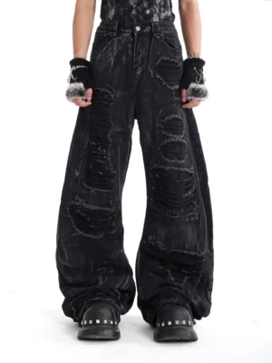 Charcoal ash destroyed balloon jeans front view with acid wash, shredded ripped panels, and ultra baggy wide-leg streetwear fit