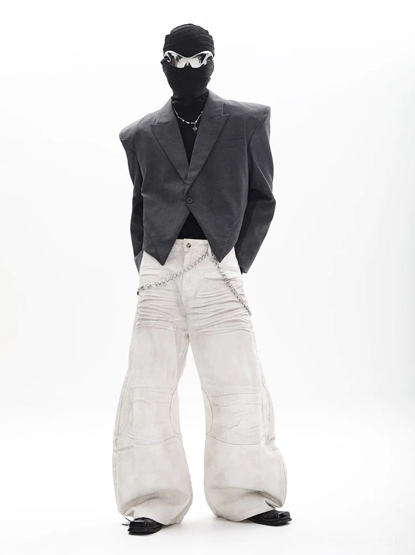 Charcoal asymmetric cropped blazer with single button closure and structured shoulders in futuristic Seoul streetwear outfit