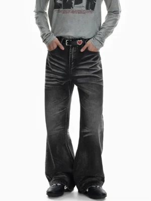 Full front view of charcoal black flare jeans featuring heavy front thigh fading, classic five-pocket construction, relaxed wide legs, and a retro Seoul streetwear silhouette